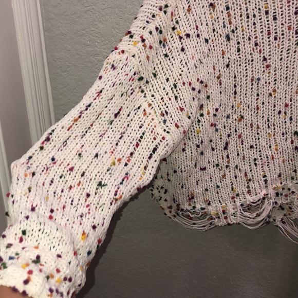 A cute colorful sweater with  a distressed bottom - Picture 2 of 6